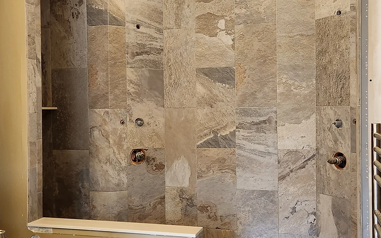 Stone Shower with Bench — luxury shower tile installation by Lotto Custom Tile