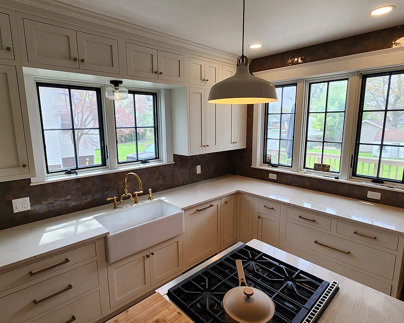 Luxury custom tile kitchen with bronze backsplash by Lotto Custom Tile