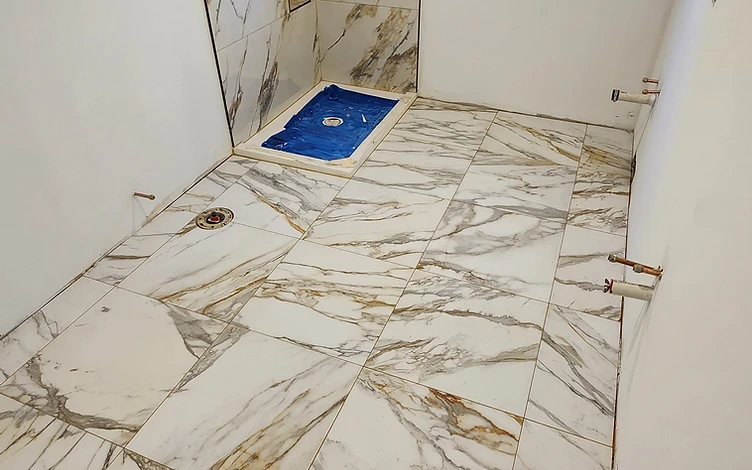 Marble Shower with Window — luxury shower tile installation by Lotto Custom Tile