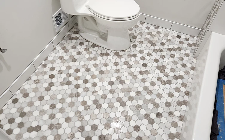 Hex Marble Bath Floor — luxury bathroom tile installation by Lotto Custom Tile