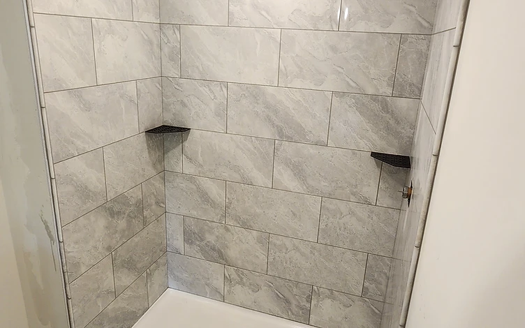 Glass Subway Tile with Custom Niche — luxury shower tile installation by Lotto Custom Tile