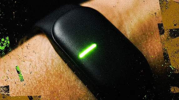 macro shot of the annoying bracelet with glowing neon green LED