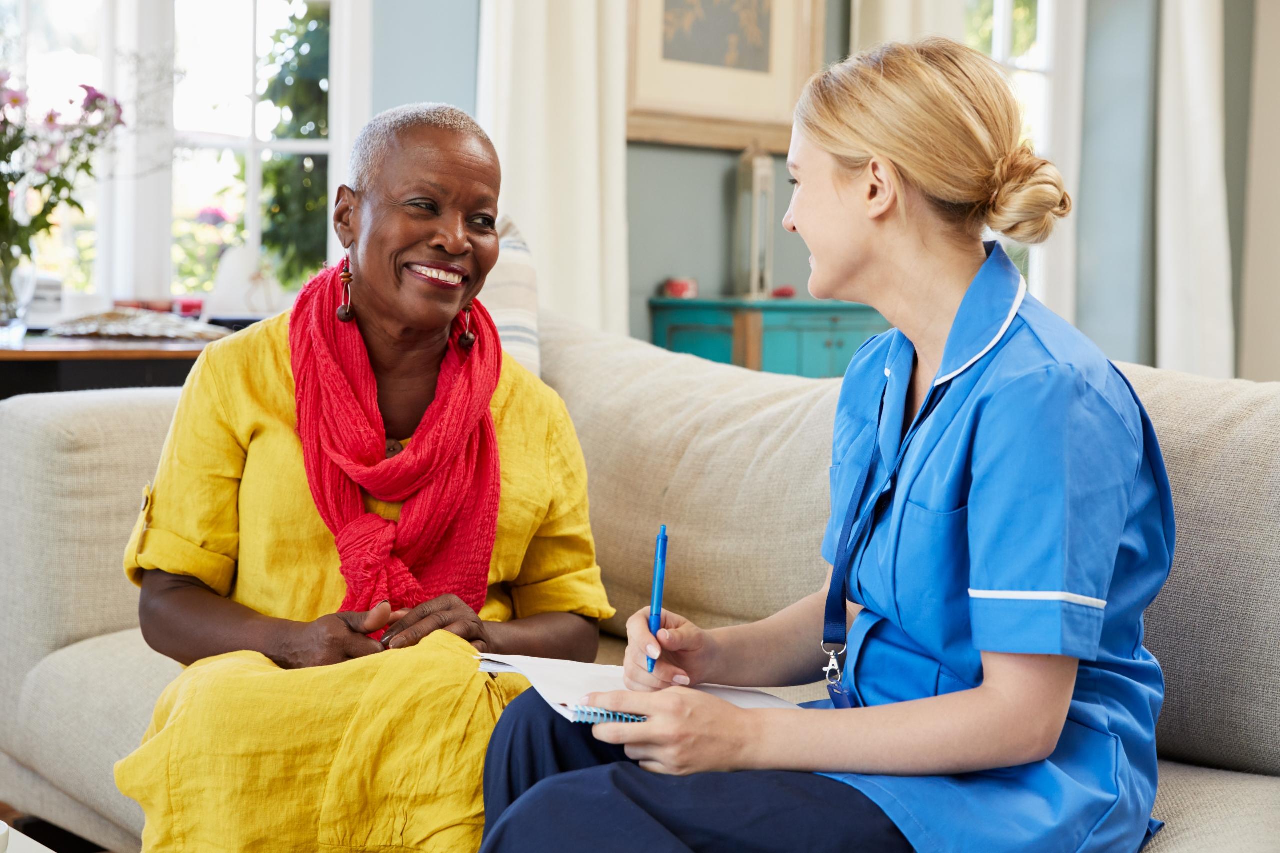 Carer supporting a client at home