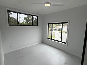 Hamilton St photo 5 — Bedroom — black-framed windows, ceiling fan