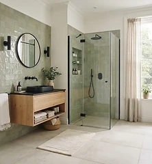 Sage green bathroom with oak vanity