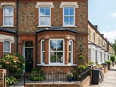 Newly installed white bay window on a Victorian terraced house