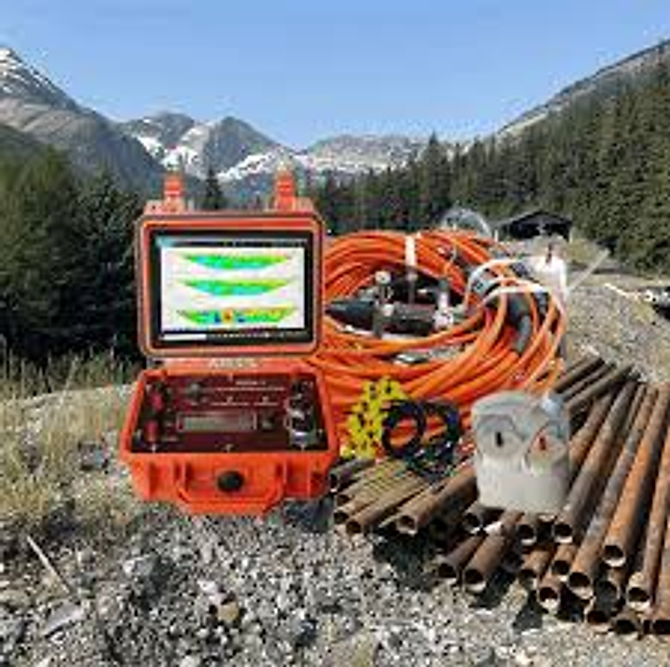 Subsurface imaging resistivity meter control unit with cable spool and electrode stakes on site