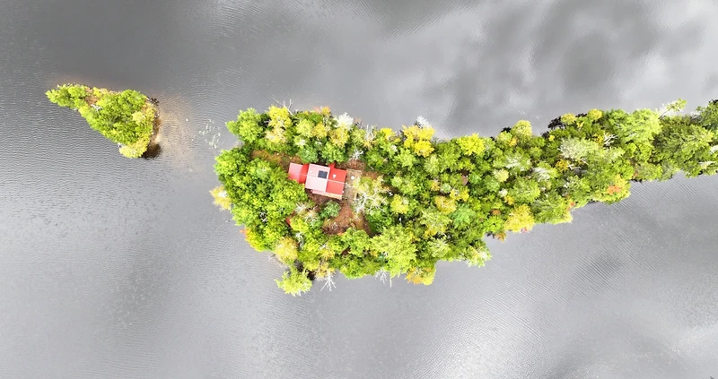Aerial view of an island cabin on Willoughby Lake
