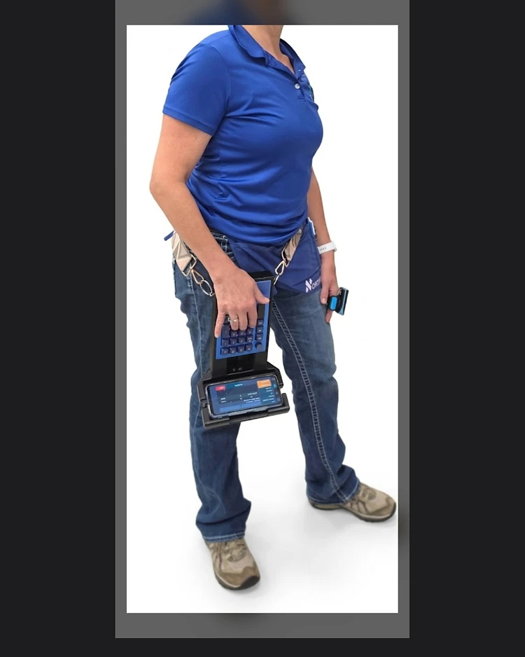 MICS unit worn on a belt in field use with phone mounted and app active