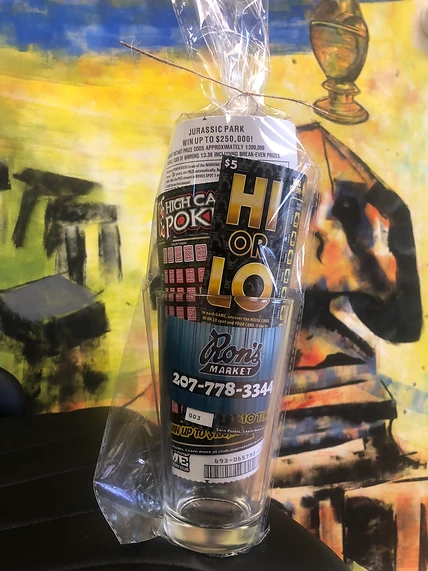 Ron’s Market pint mug wrapped with scratch tickets inside