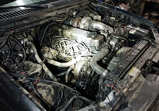 Greasy diesel engine bay, phone snapshot