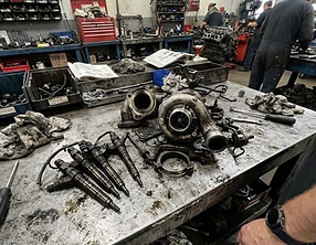 Removed injectors and turbo parts on the workbench