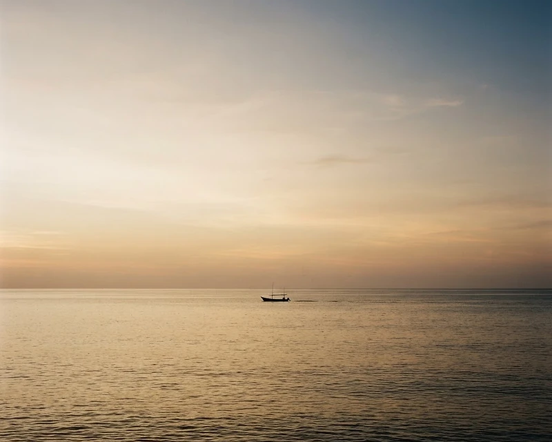 A sun-drenched Mediterranean coastal village at golden hour