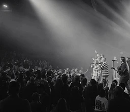 Black-and-white photograph of the worship team and congregation at a past gathering