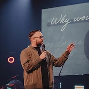 A speaker addressing the congregation at a past event