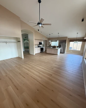 Open-concept kitchen and living LVP