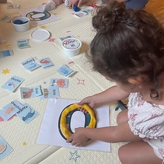 Shaping the letter O with dough