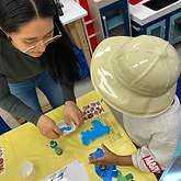 Dino painting with the explorer helmet