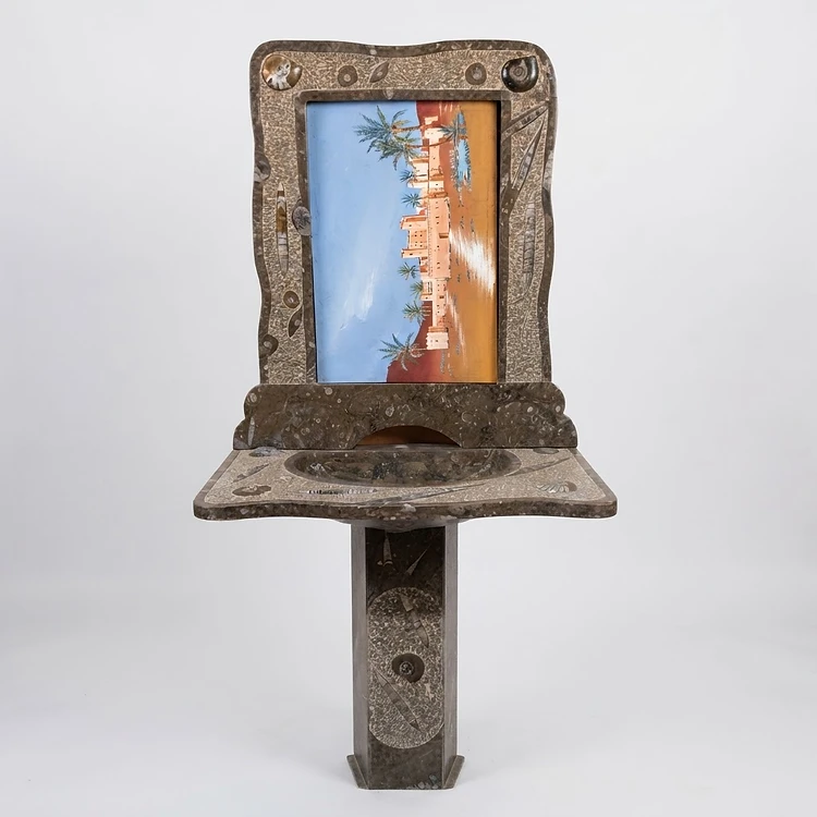 Lavabo artesanal de piedra con fósiles marinos