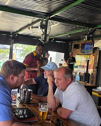 Friends and family enjoying a meal together at Ferreira's