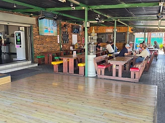 Live musician on the patio stage at Ferreira's