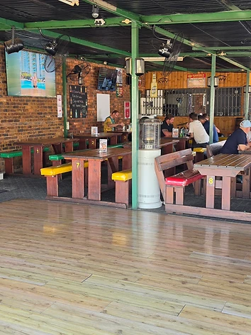 Live musician performing on the patio stage