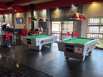 Pool tables under the pendant lights