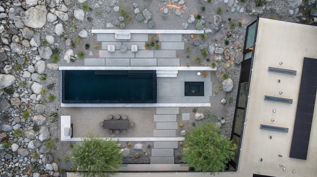 Aerial view of the Wabi-Sabi House site showing building footprint, pool, terraces, boulder field, and surrounding terrain.