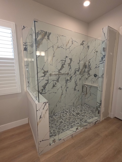 Frameless glass shower enclosure installed by Holland Glass & Mirror in a Coachella Valley home