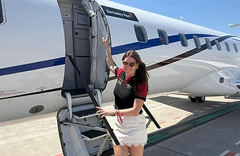Berkeley Red branded private jet on the tarmac
