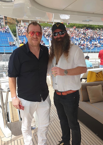 Rich Energy CEO Will Storey with a Berkeley Red host on a yacht overlooking the Monaco Grand Prix