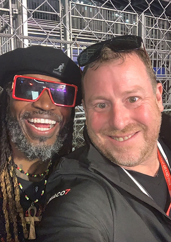 Chris Gayle taking a selfie with a Berkeley Red host at the Monaco Grand Prix