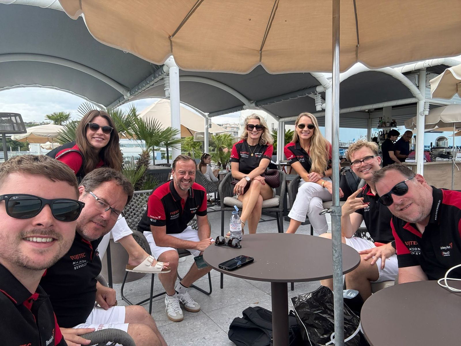 Berkeley Red team socialising with clients at a marina terrace
