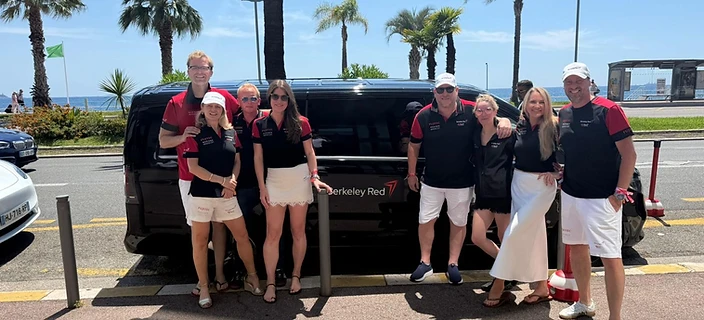 The Berkeley Red team in front of their branded vehicle