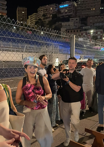 Saxophonist Ellie Sax enjoying race night trackside in her sequinned captain's hat