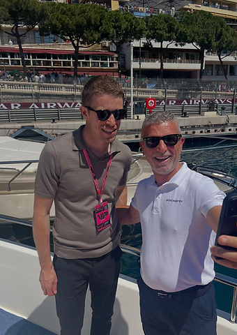 Paul Di Resta with a guest taking a selfie aboard a yacht in the Monaco harbour