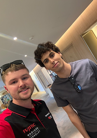 F1 driver Gabriel Bortoleto taking a selfie with a Berkeley Red host