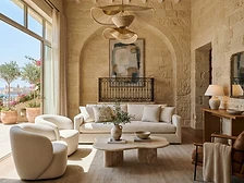 Sunlit boutique hotel lounge with upholstered seating