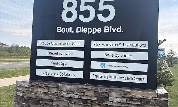 855 Boul. Dieppe Blvd. building directory sign — The Tooth Fairy Cosmetics
