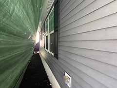 Tarp Secured Against Home