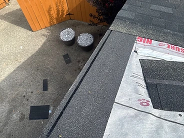 Dark granulated starter strip shingle installed along the bottom roof edge partially overlapping a white metal drip edge over TITANIUM PSU30 underlayment