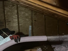 Technician Installing Insulation