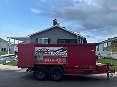Company-Owned Debris Trailer on Site