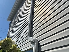 White Downspout with Offset Elbows