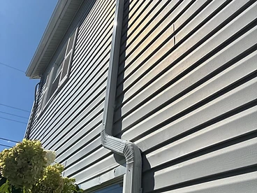 White Downspout Installation