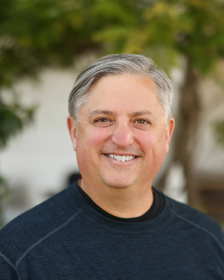 Portrait of Carson D. Kelly, organizational strategist and founder of Compassion 2.0, photographed outdoors