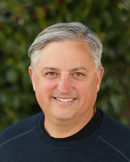 Portrait of Carson D. Kelly, founder of Compassion 2.0, photographed outdoors in soft natural light