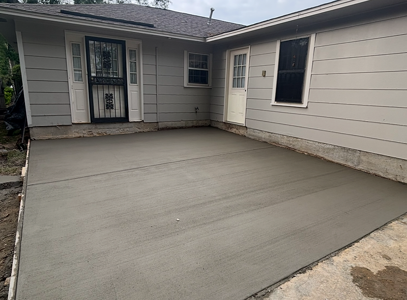 Finished concrete patio on a coastal Mississippi property by Holland’s Construction