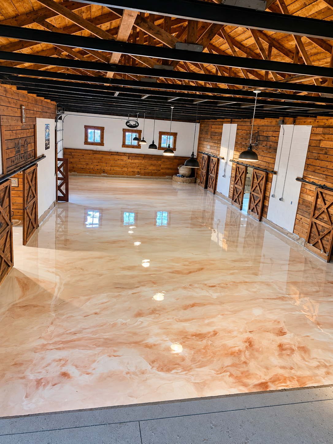 Marbled copper and cream metallic epoxy floor in a finished barn interior