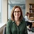 AI-generated portrait representing Naomi Fischer (AI Analyst, not a real person)